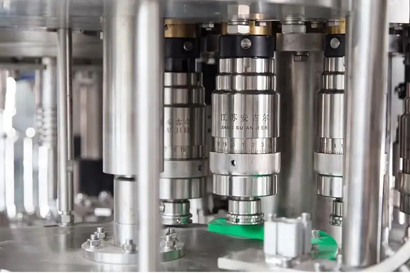 Capping heads of a juice and tea filling machine